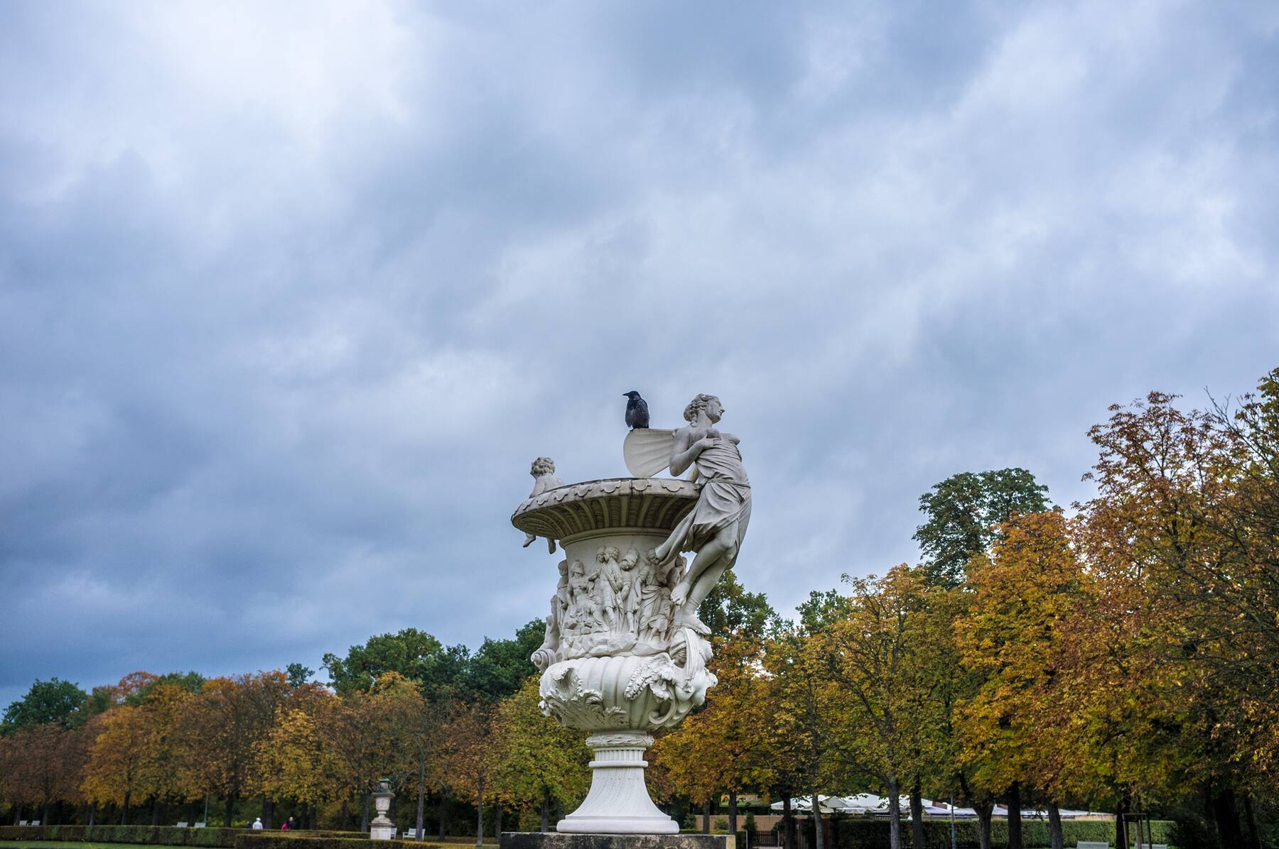 A crow perched on a baroque sculpture