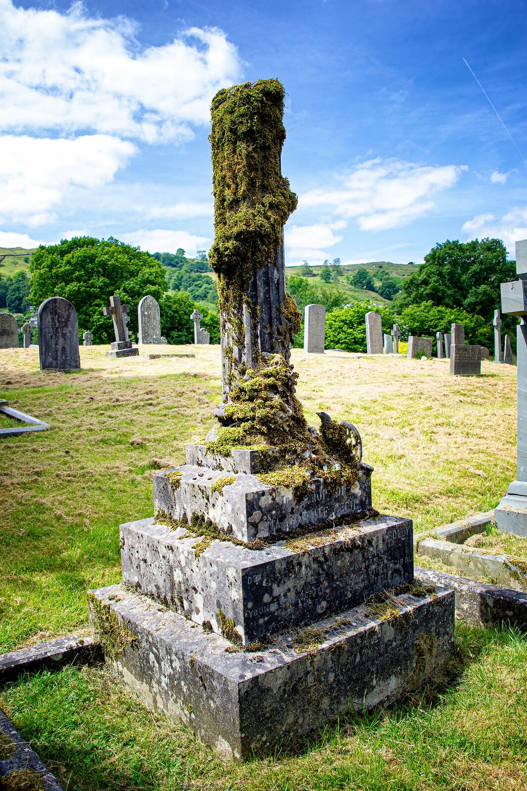 Moss-covered cross in the churchyard