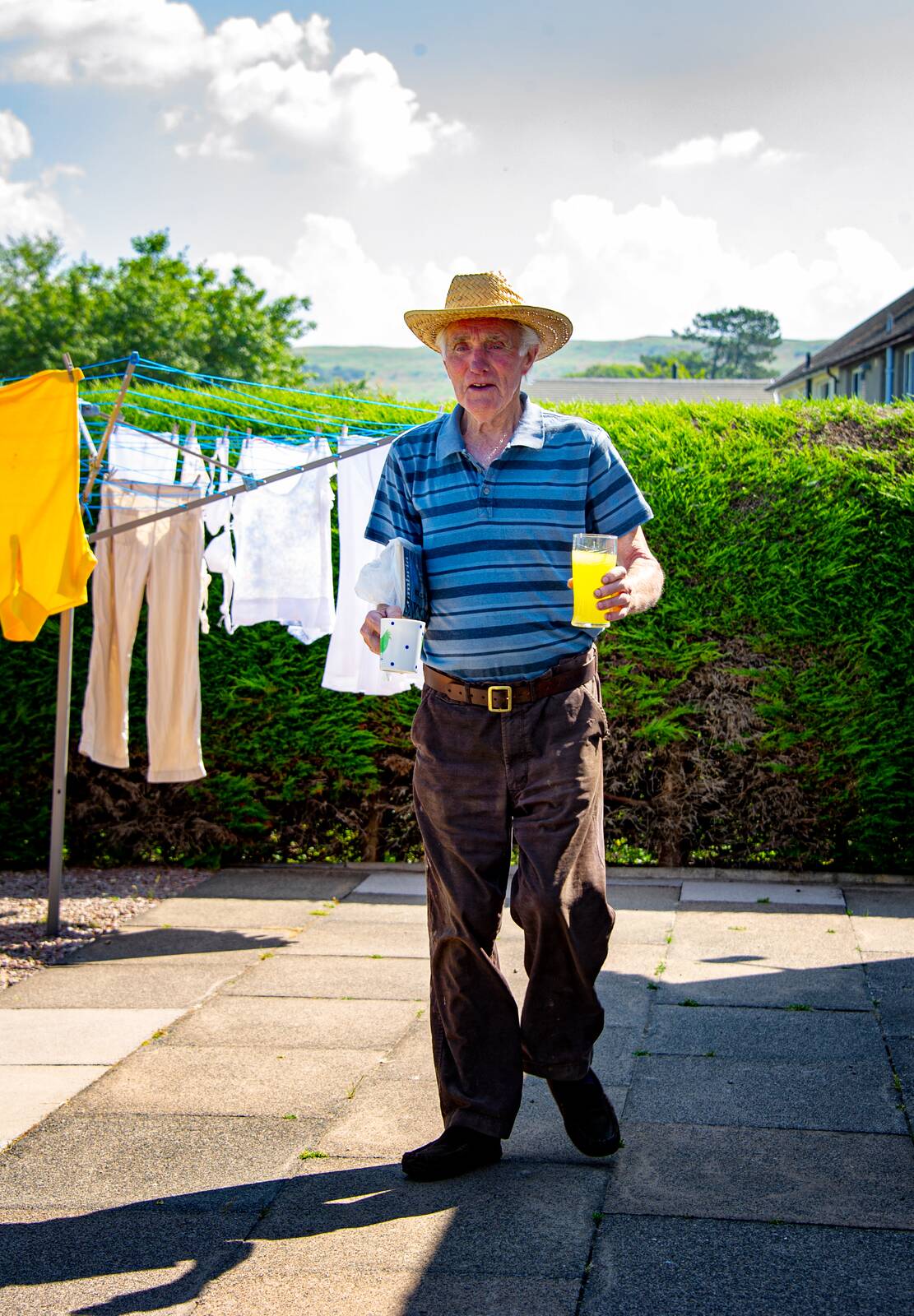 Bill by the washing line with a mug of tea