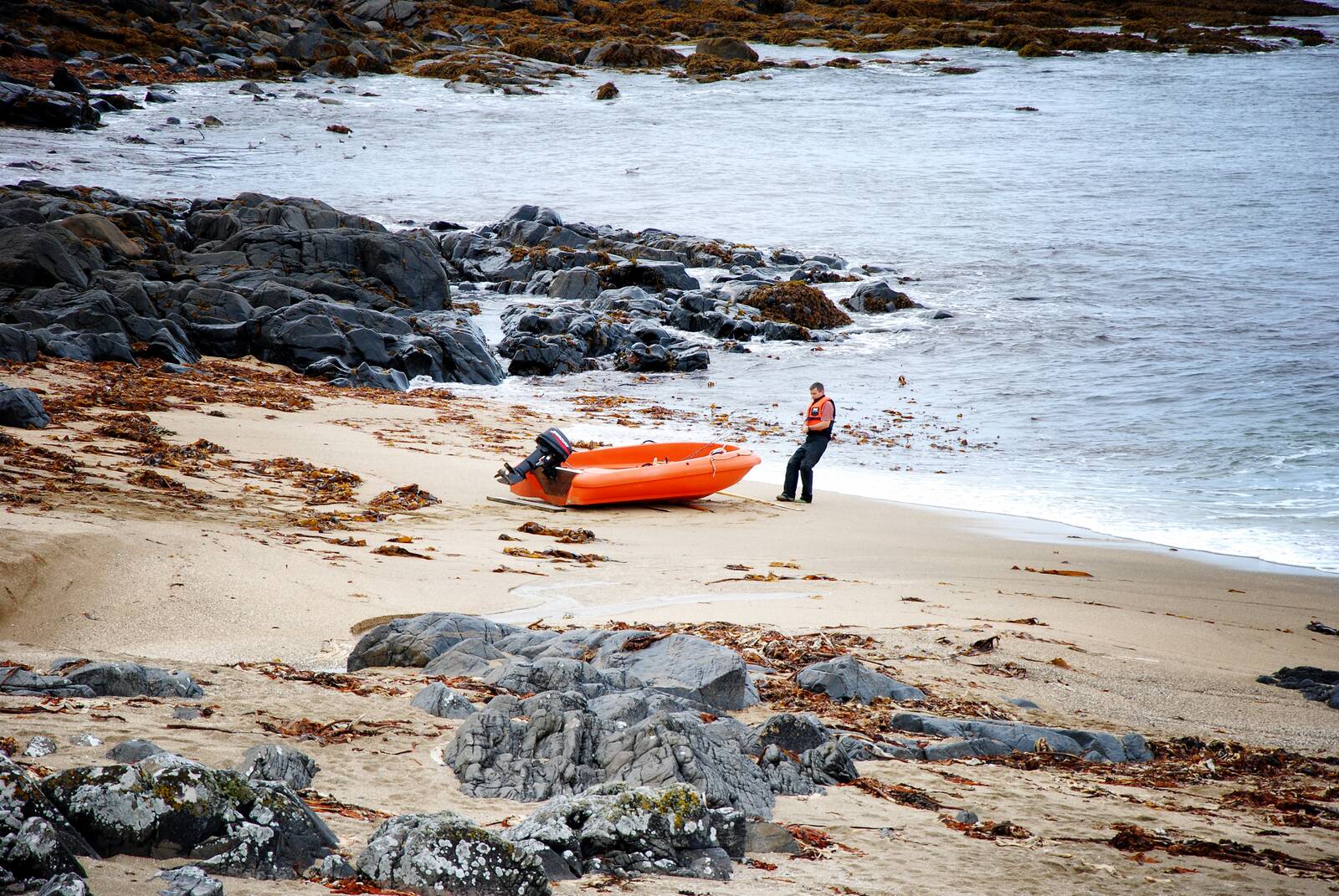 An orange dinghy on Luskentyre beach